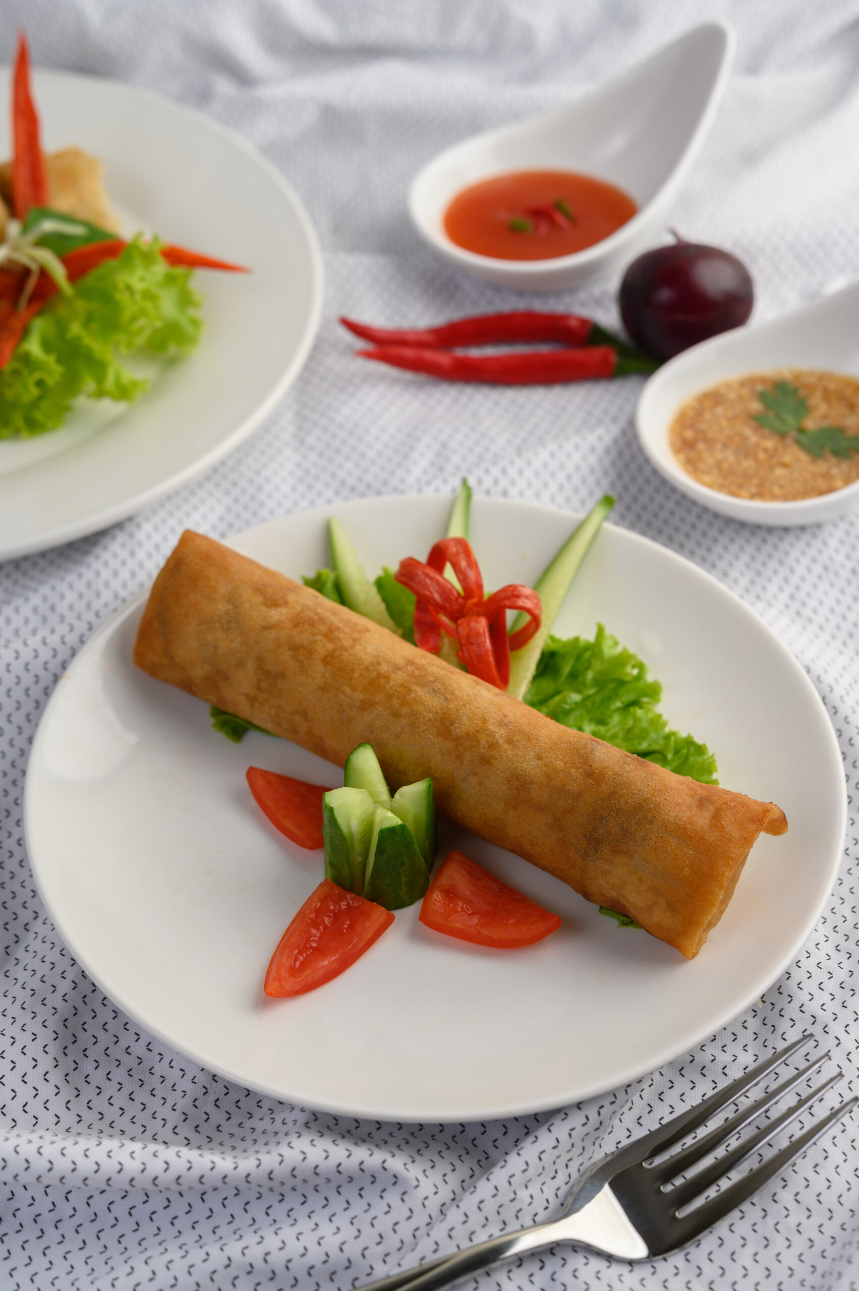 egg roll or fried spring rolls on the white plate thai food. sel